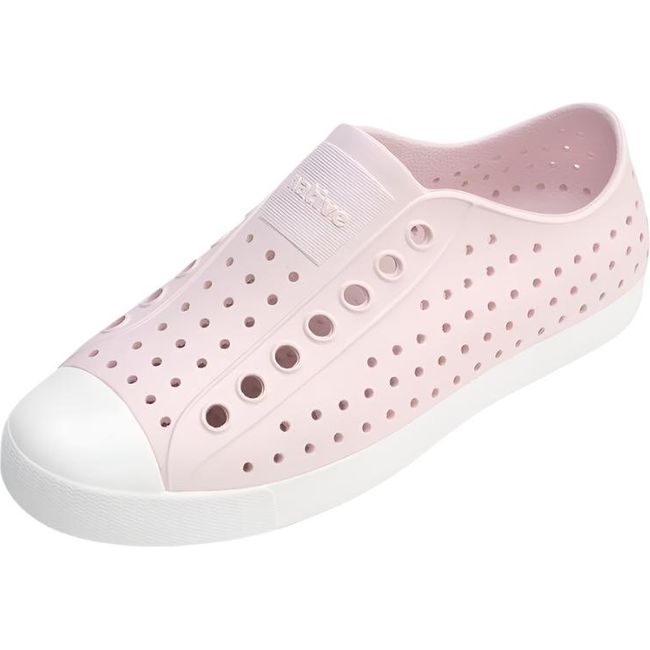 Overhead view of the Native Big Kids' Jefferson Shoe in pink, featuring a slip-on design, lightweight and hand-washable Sugarlite™ material, a perforated upper similar to Crocs, a white toe cap, and a white sole.