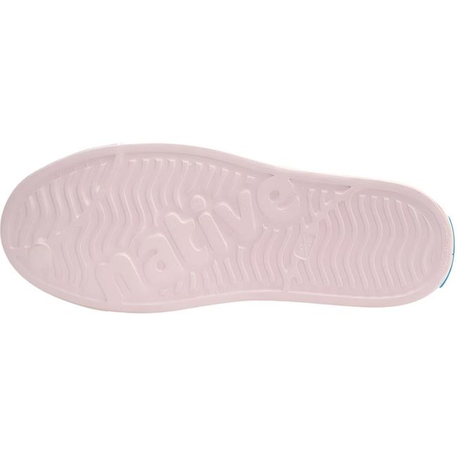 Sole view of the Native Big Kids' Jefferson Shoe in pink, featuring the word 'native' embossed in the tread.