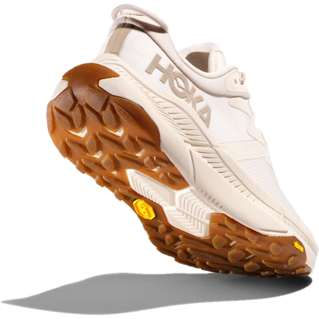 Sole of Hoka Women's Transport Lifestyle Shoe in eggnog upper color with tan rugged vibram tread