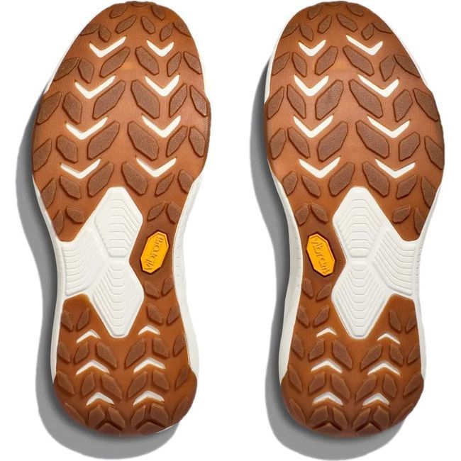Sole view of a pair of Hoka Women's Transport Lifestyle Shoe with tan rugged vibram tread