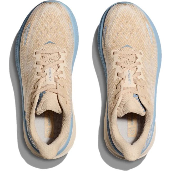 Top down view of Women's Hoka Clifton 9 Running Shoes in Oak Alabaster tan and blue colors