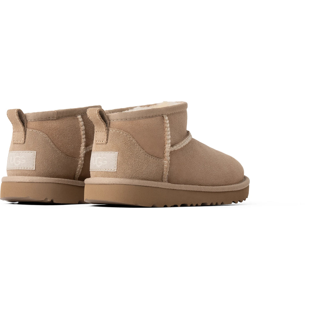 Heel of UGG Kids' Classic Ultra Mini Boot (Little Kid/Youth) in Sand