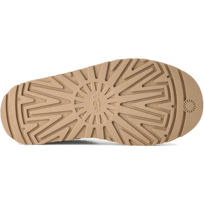 Brown sole of UGG Youth Tazz Clog in Sand Suede