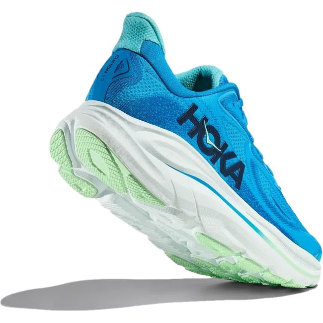 Heel angled up showing tread of Men's Hoka Clifton 10 Running Shoe in Hoka Blue and Skyward Blue