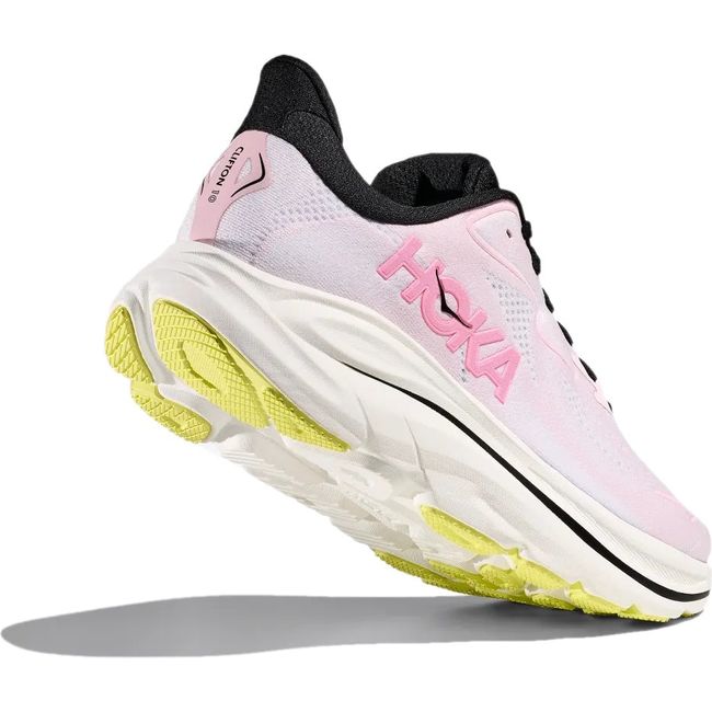 Heel angled up showing tread of Hoka Womens Clifton 10 Running Shoe in Carnation Starlight Glow pink