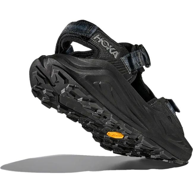 Vibram sole of Men's Hoka Infini Hike TC Hiking Sandal in all Black
