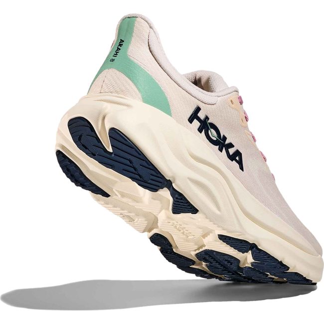 Heel angled up showing sole of Men's Hoka Arahi 8 Running Shoe in Rose Cream Alabaster