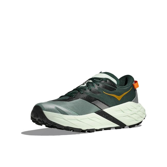 Medial profile of Hoka Speedgoat 7 in sea glass and bay leaf showing woven upper