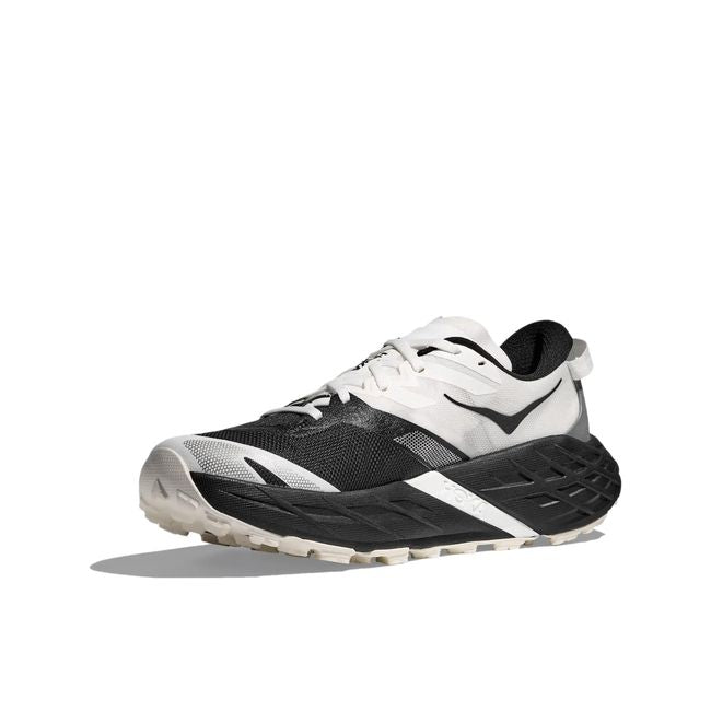 Medial profile of Hoka Speedgoat 7 in black showing woven textile upper