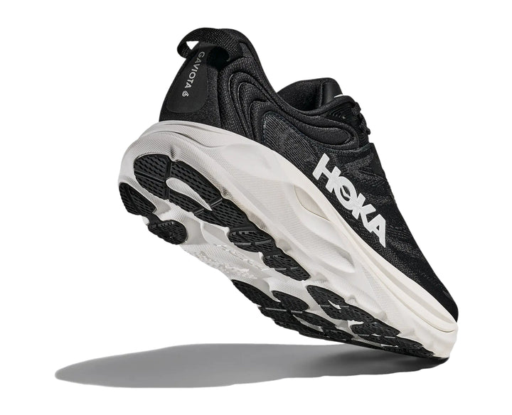Hoka Mens Gaviota 6 running shoe in Black/White, angled outsole and heel tread detail
