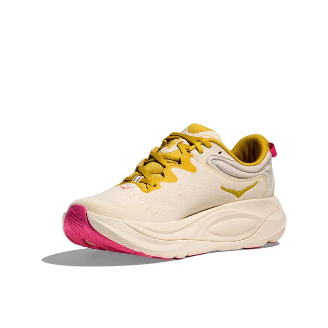 Medial side profile of Hoka Gaviota 6 women's shoe in birch showing compression-molded midsole and yellow gold lacing