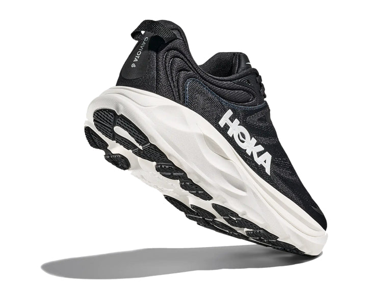 Hoka Womens Gaviota 6 running shoe in Black/White, angled outsole and heel tread detail