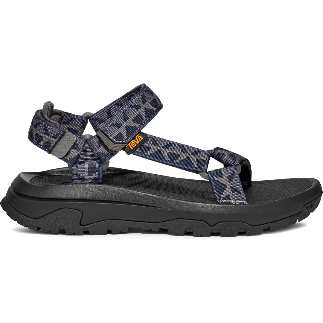 Side of Teva Men's Hurricane XLT3 Sandal in Criss Cross Navy/Grey