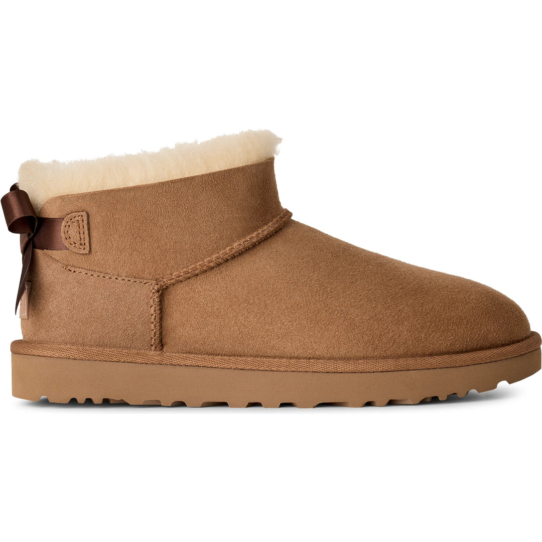 Side of UGG Women's Ultra Mini Bailey Bow Boot in Chestnut