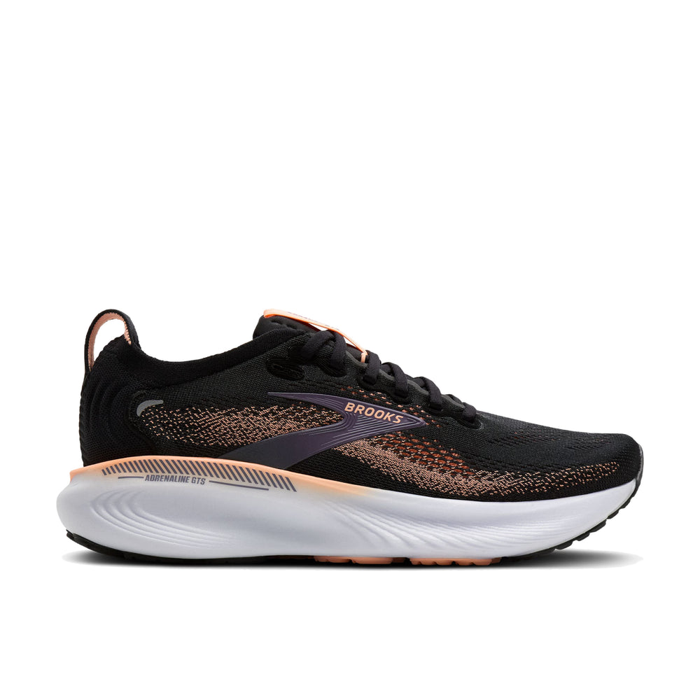 Lateral side profile of Brooks Adrenaline GTS 25 in black and peach showing GuideRails support structure and midsole stack