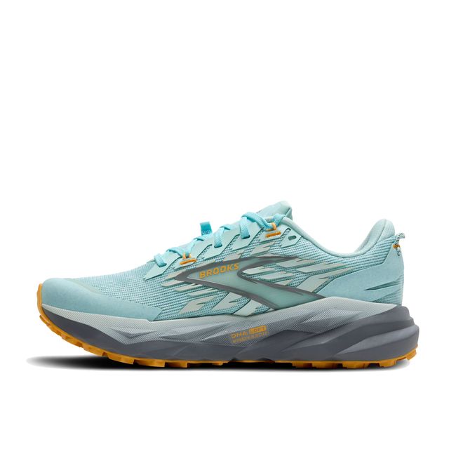 Medial side of Brooks Women’s Cascadia 19 trail running shoe in blue with grey cushioned midsole.