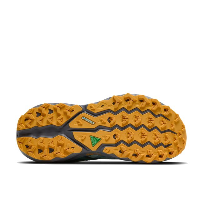 Yellow sole of Brooks Women’s Cascadia 19 trail running shoe in blue with grey cushioned midsole.