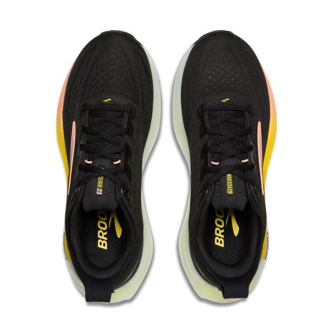 Top-down pair of Brooks Glycerin 23 in black showing mesh upper with yellow and peach accent details