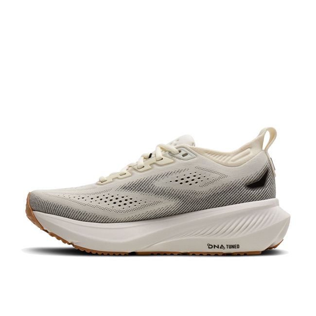 Medial profile of Brooks Glycerin 23 in white and biscuit showing plush cushioned midsole stack