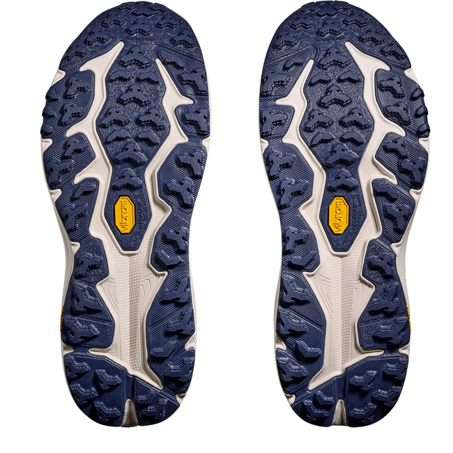 Soles of Hoka Men's Speedgoat 6 Trail Running Shoe in Midnight Blue