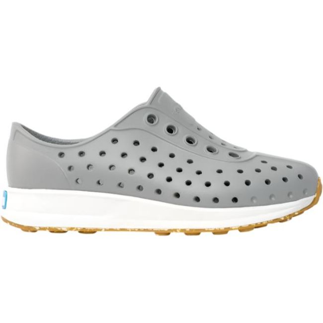 Lateral side view of the Native Big Kids' Robbie Shoe in pigeon grey, featuring a perforated Sugarlite™ upper similar to Crocs, ultra-grippy rubber outsole with recycled content, and a slip-on style.