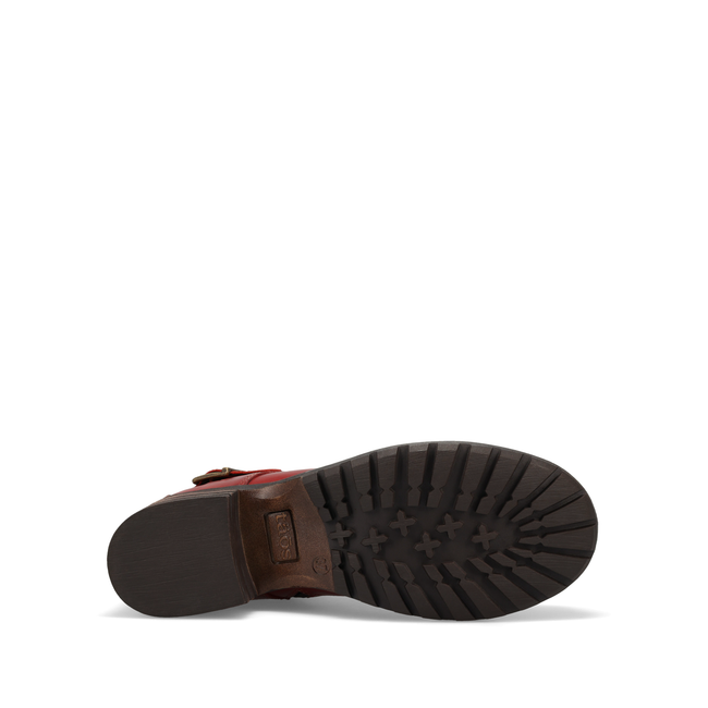 Outsole of the Taos Mini Crave ankle boot in red leather showing the tread
