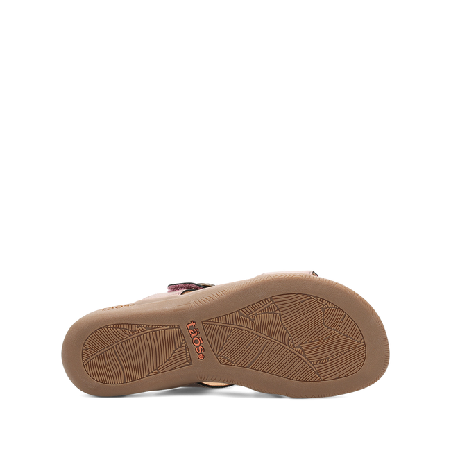 Outsole of the Taos Westside sandal in metallic violet showing the tread