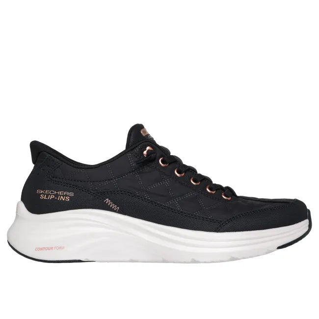 Black Skechers Slip-ins Cozy Fit Golden Hour women’s sneaker with quilted texture, rose‑gold accents, and white sole.
