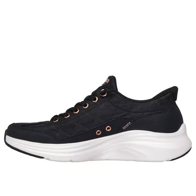 Black Skechers Slip-ins Cozy Fit Golden Hour women’s sneaker showing rose‑gold accents and cushioned white midsole.