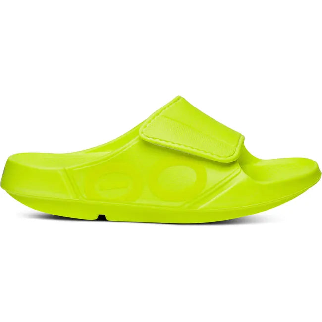 Lateral side of Unisex OOfos OOahh Sport Flex Slide Sandal in Electro Yellow with velcro strap