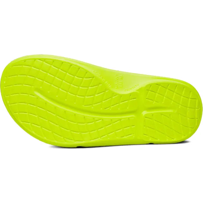 Sole of Unisex OOfos OOahh Sport Flex Slide Sandal in Electro Yellow