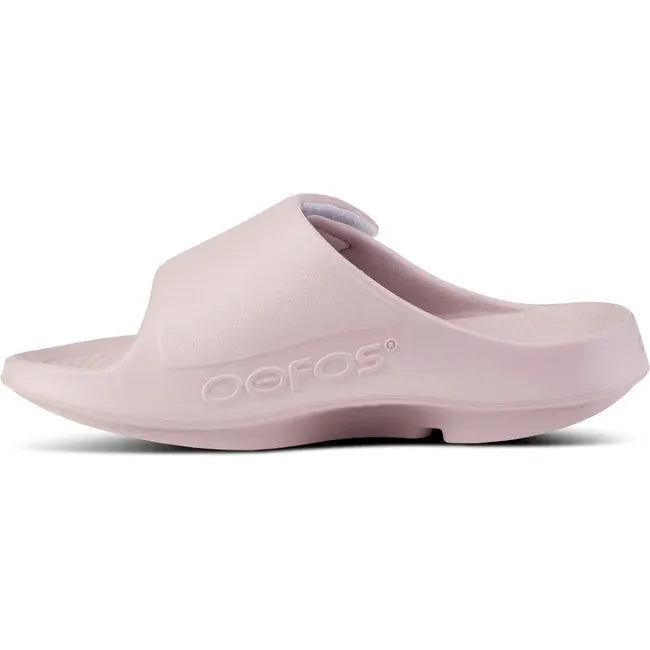 Medial side of Unisex OOfos OOahh Sport Flex Slide Sandal in Stardust Pink with velcro strap