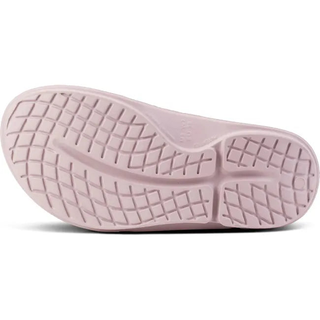 Sole of Unisex OOfos OOahh Sport Flex Slide Sandal in Stardust Pink