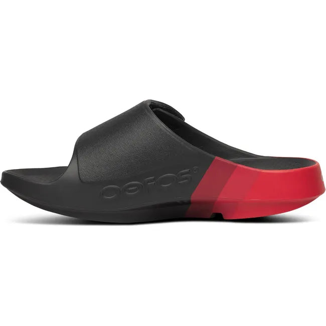 Medial of Unisex OOfos OOahh Sport Flex Slide Sandal in Black and Fire Rally Red with velcro strap