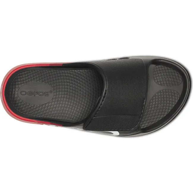 Upper of Unisex OOfos OOahh Sport Flex Slide Sandal in Black and Fire Rally Red with velcro strap
