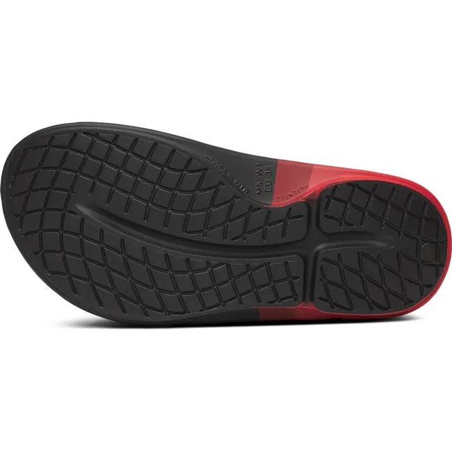 Sole of Unisex OOfos OOahh Sport Flex Slide Sandal in Black and Fire Rally Red 