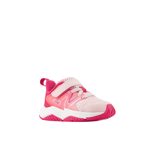 Angled side of New Balance Kids' Rave Run V2 Bungee Lace Top Strap Running Shoe (Infant/Toddler) in Rose Sugar