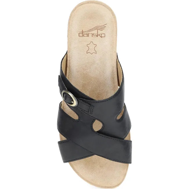 Dansko Regan slide sandal in black leather, top view showing woven strap pattern