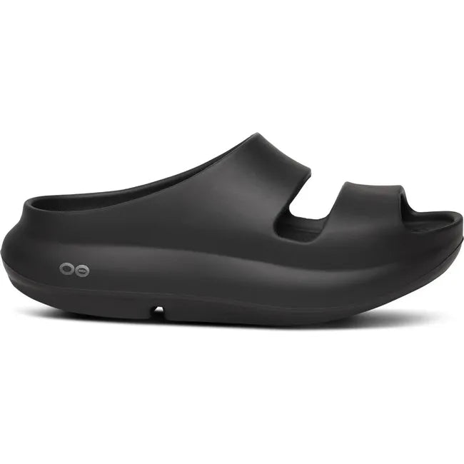 Lateral side of Women's OOfos OOyea Slide Sandal in Black