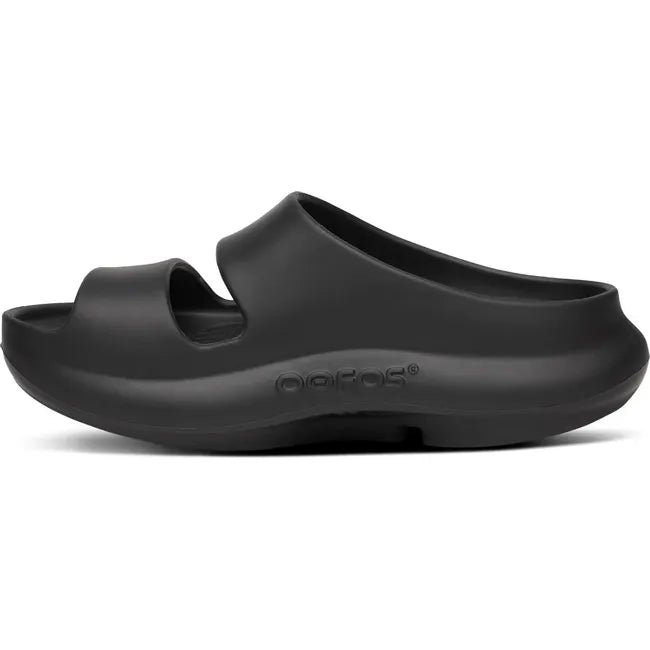 Medial side of Women's OOfos OOyea Slide Sandal in Black
