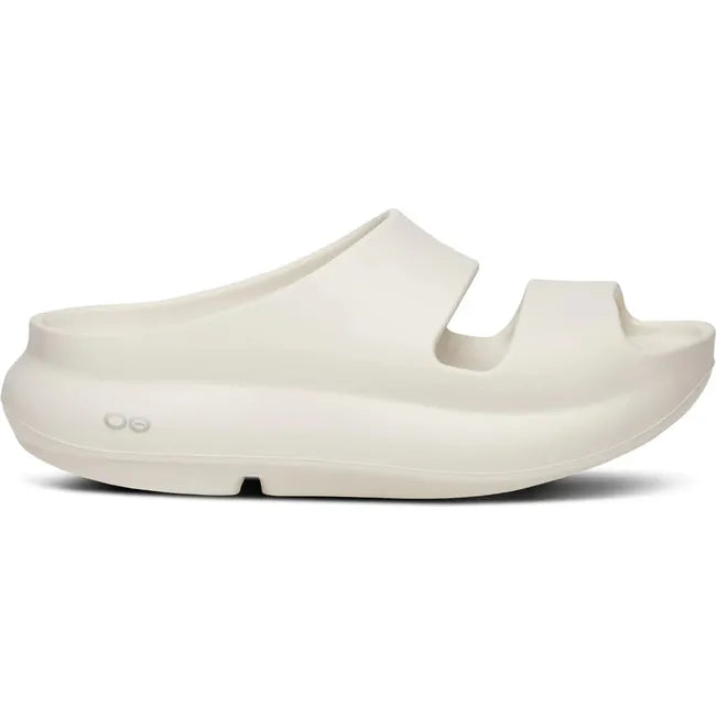 Lateral side of Women's OOfos OOyea Slide Sandal in Chalk off white