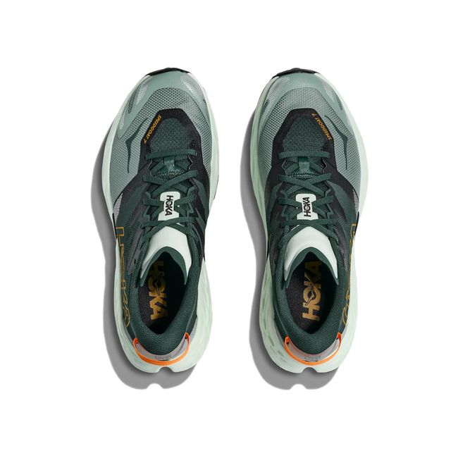 Top-down pair of Hoka Speedgoat 7 in bay leaf and sea glass showing woven upper and lace system