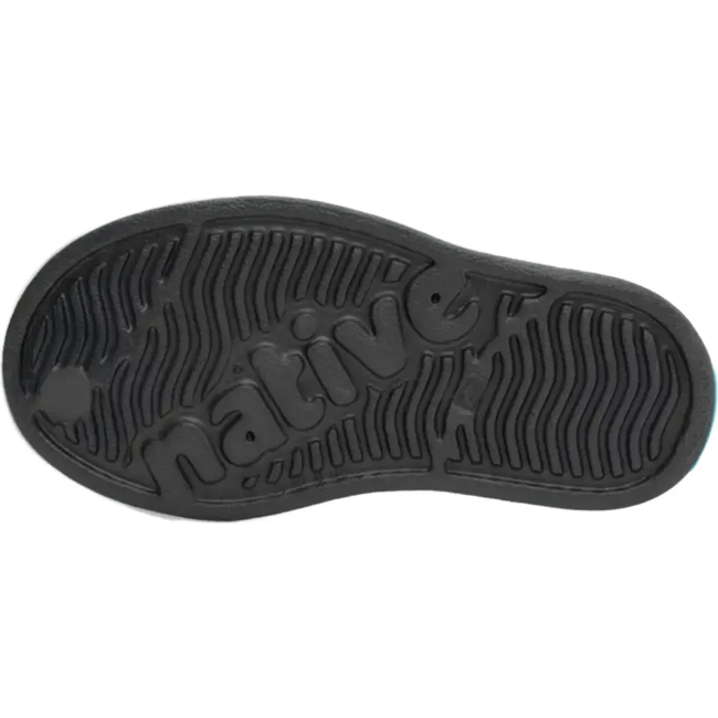 Sole view of the Native Kids' Jefferson Shoe in dark gray, featuring the word 'native' embossed in the tread.