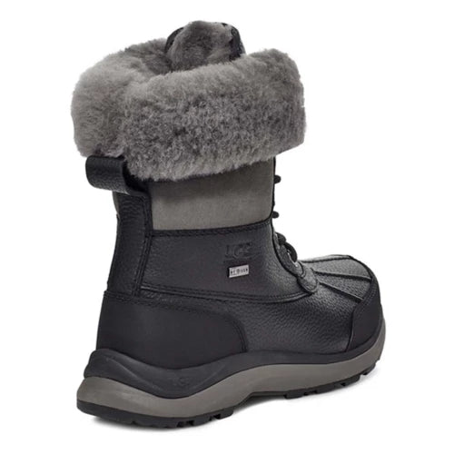 Heel angled of Women's Ugg Adirondack Boot III Waterproof leather in black and grey. Lace closure