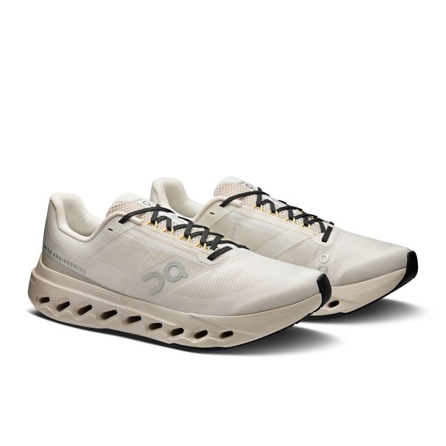 Pair of On Running Women's Cloudsurfer Next Running Shoes in ivory beige and silver