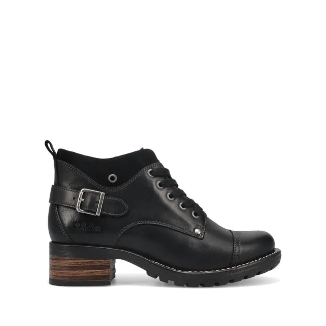 Lateral side of Women's Taos Mini Crave Boot in black leather. Ankle height and lace up closure