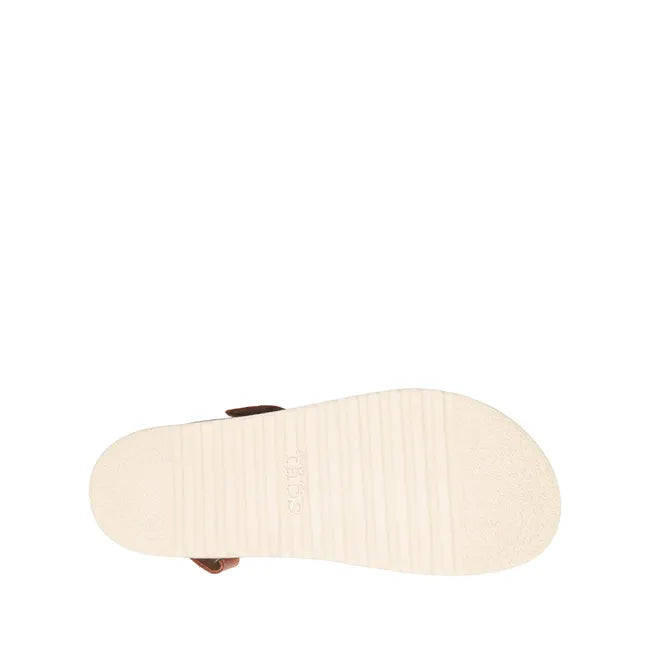 White sole of Women's Taos Sideways Sandal in Caramel leather upper