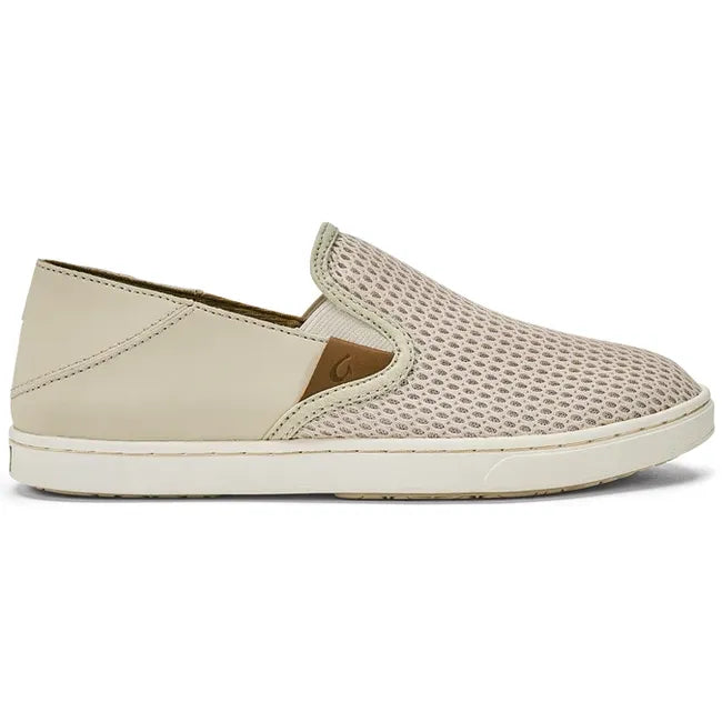 Lateral side of slip on Women's Olukai Pehuea Shoe in beige mesh with off white sole