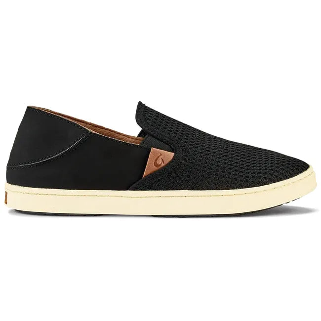 Lateral side of slip on Women's Olukai Pehuea Shoe in black mesh with off white sole