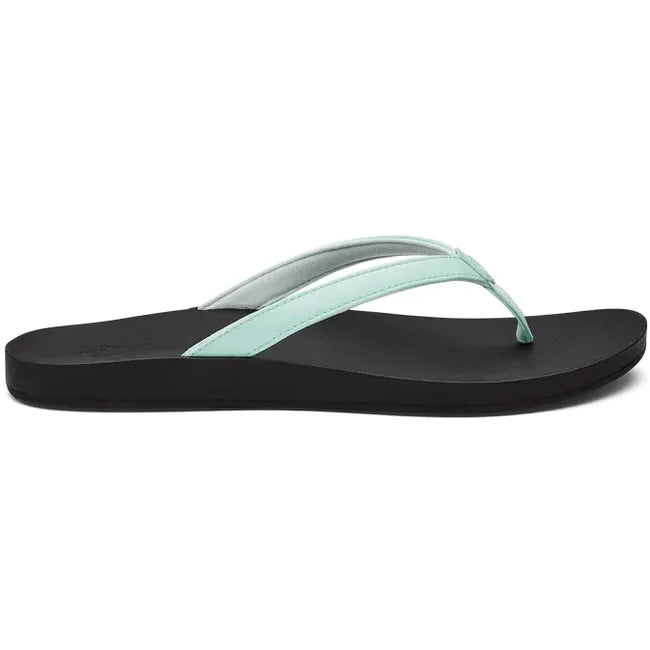 Lateral view of Women's Olukai Puawe Flip Flop with a sea glass green colored upper and black sole.